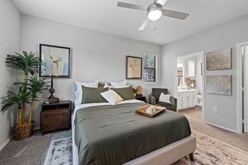 Beautiful bright bedroom with ceiling fan